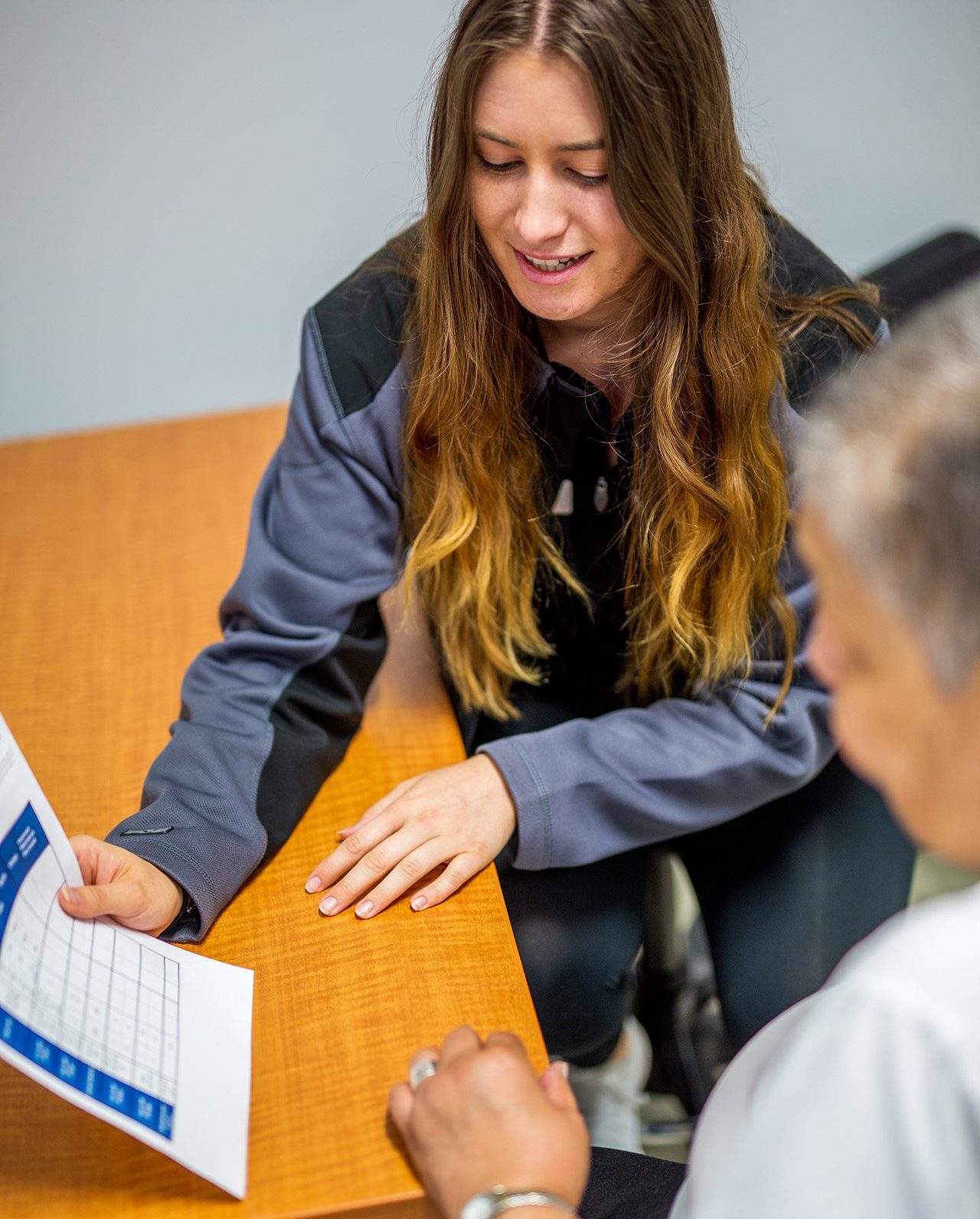 AT Intern consulting with a participant in the AT Clinic