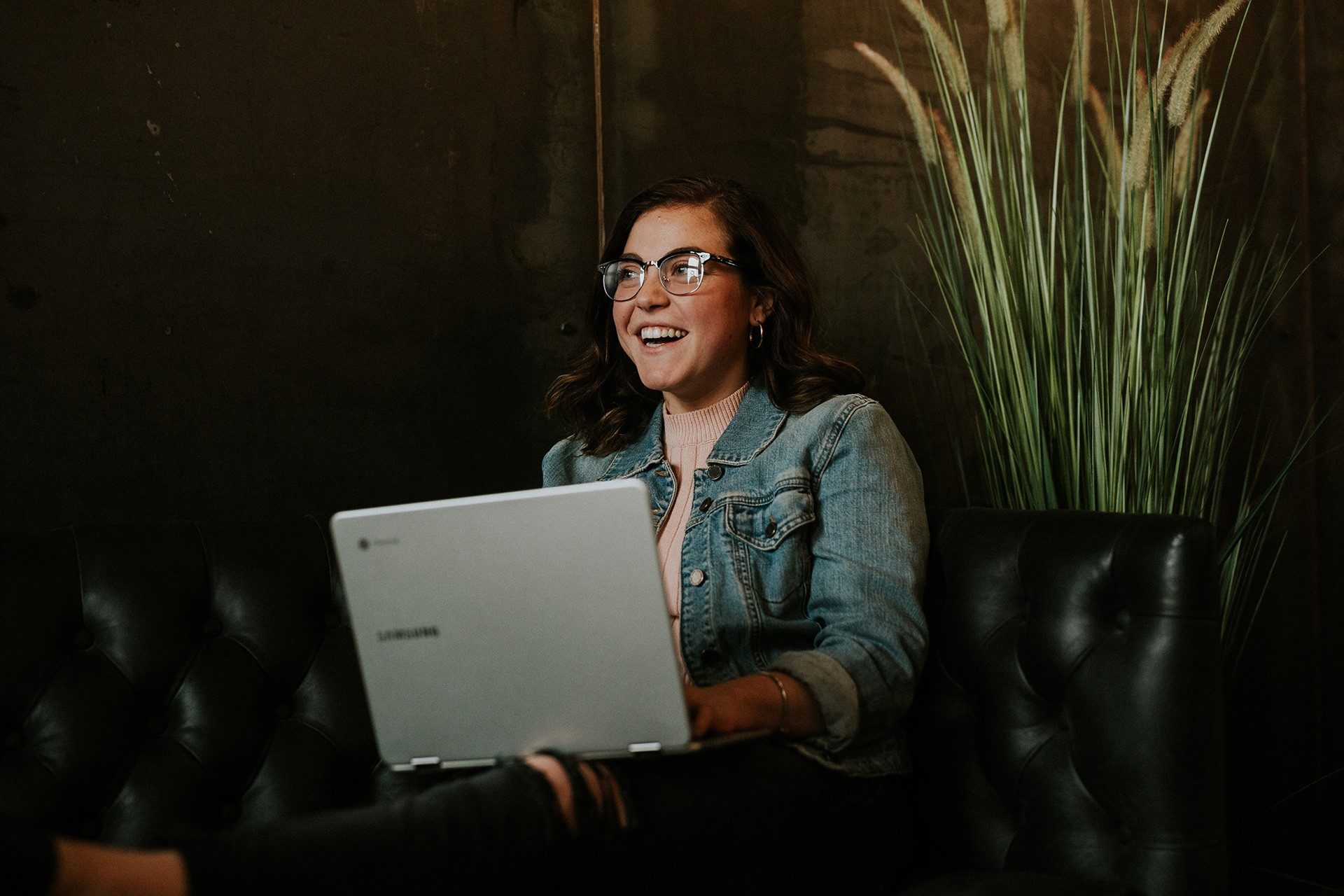 Student sitting on couch with laptop Student sitting on couch with laptop