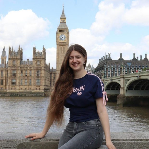 Student posing in front of Big Ben in London, England