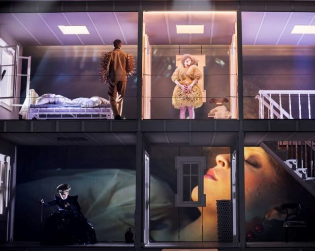 A stage with 4 theatre actors performing a play
