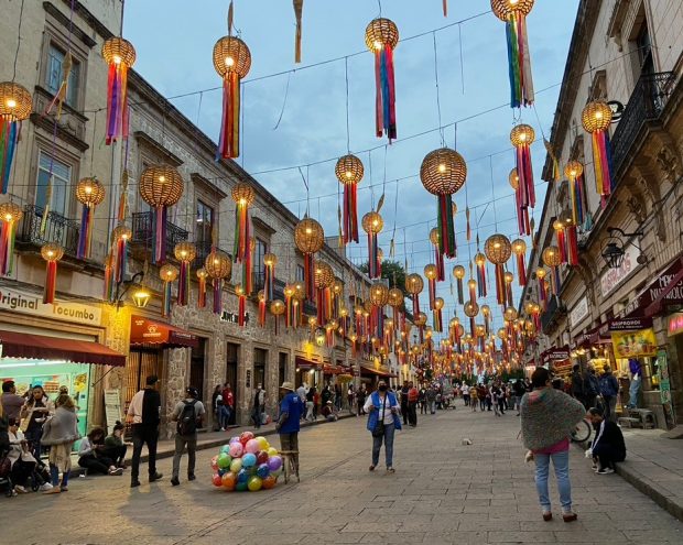 Street in Mexico with lanterns and people