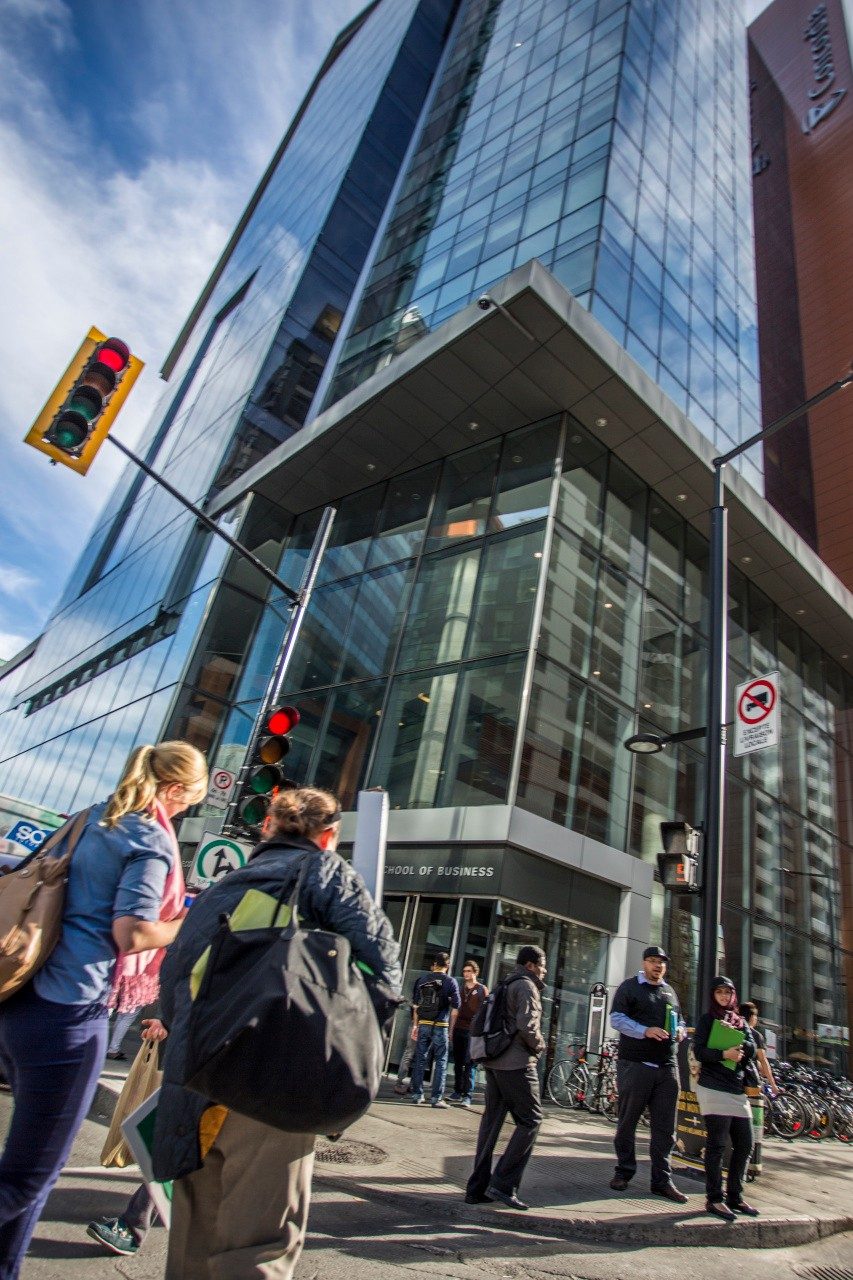 Students outside at the corner of Concordia University's John Molson School of Business building