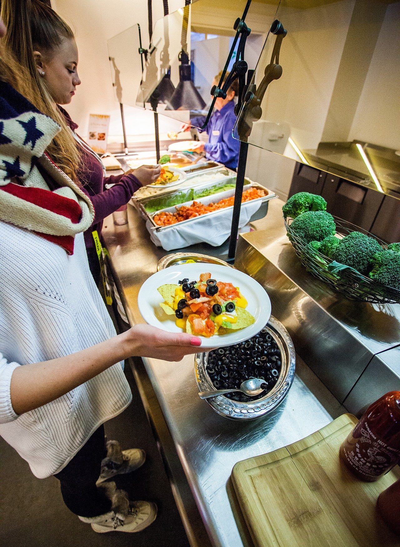 Diners at the salad bar in the residence dining hall Diners at the salad bar in the residence dining hall