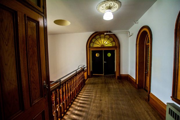 A third-floor landing and corridor leading to the west side of the Grey Nuns residence.