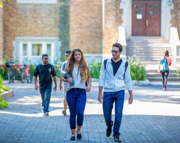 Students walk along a pathway on Concordia University's Loyola Campus