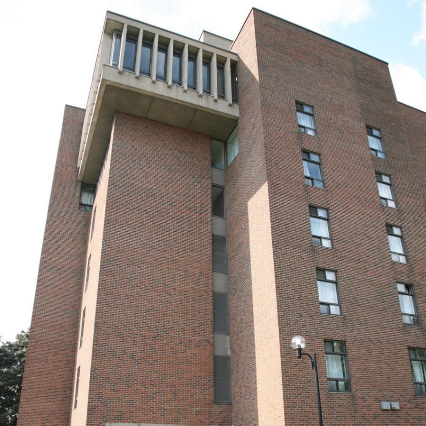 The brick facade of the Jesuit Residence entrance on Concordia University's Loyola Campus