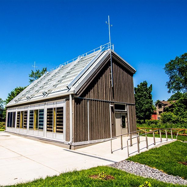 A small house covered in solar photovoltaic panels sits at the Loyola campus.