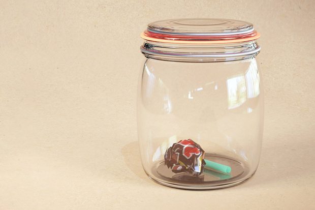 Glass jar with refuse in it.