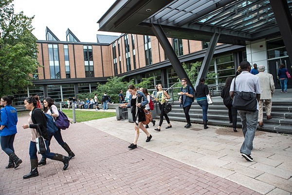 Students walk in and out of the SP building at the Loyola campus
