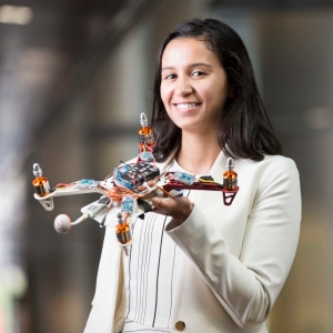 Screenshot of round image of woman holding a drone