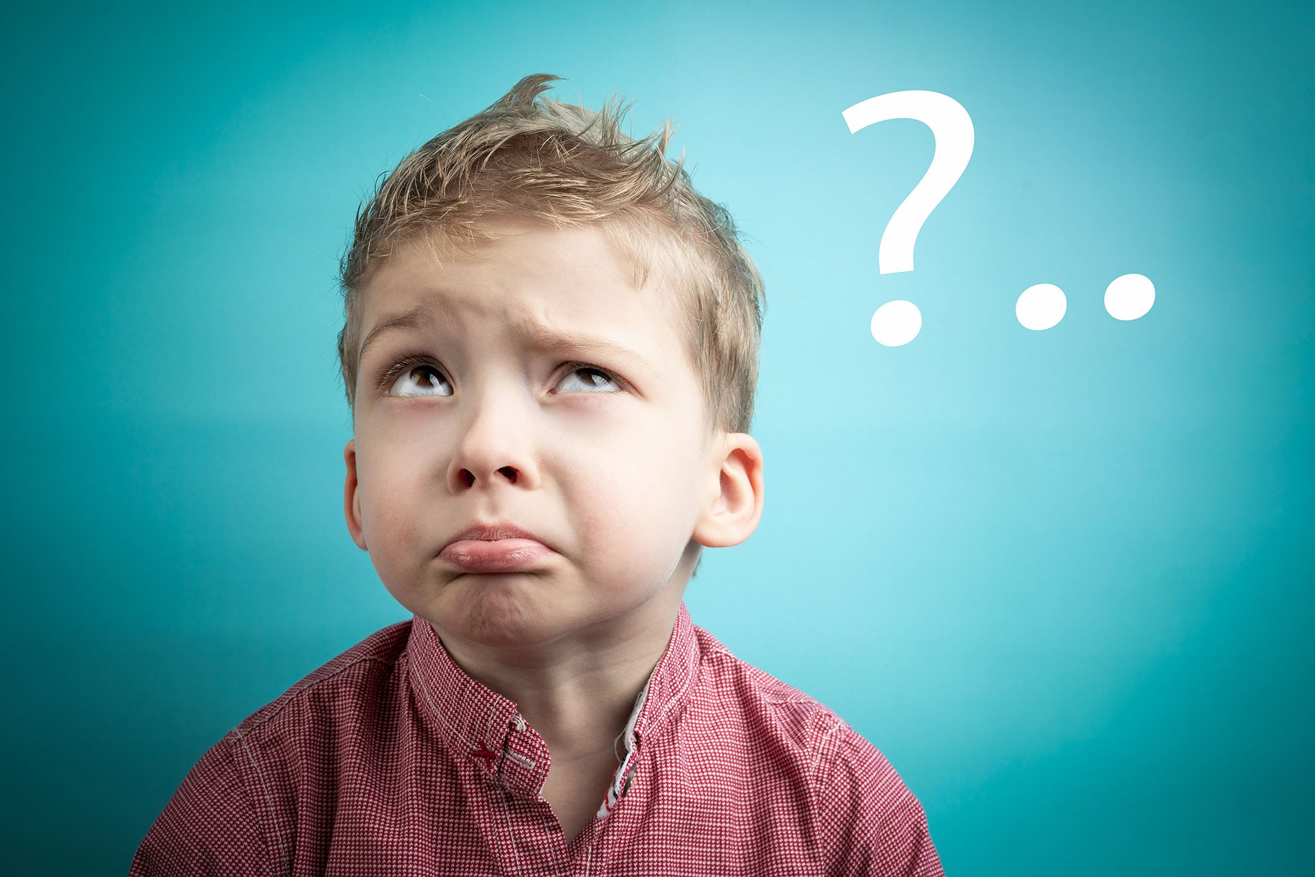 Young boy pondering questions