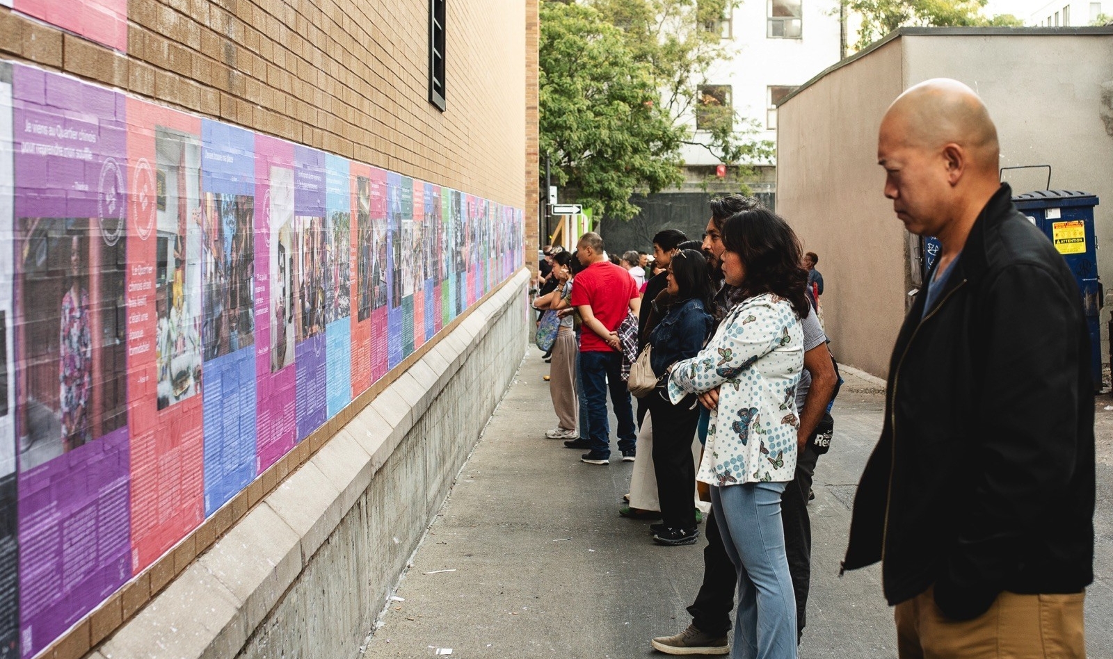 People looking at a public storytelling exhbition Made in Chinatown