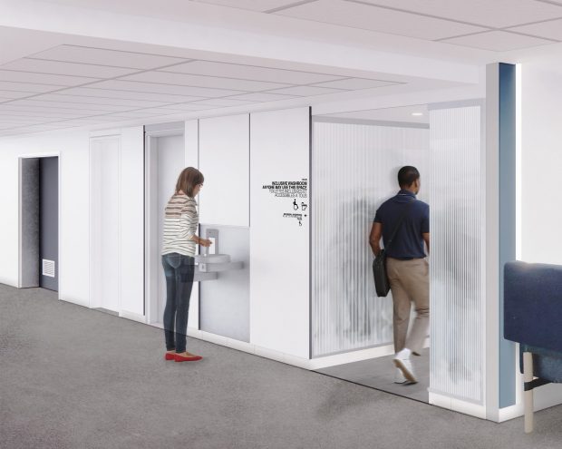 Transformation des toilettes du 8e étage du pavillon Henry-F.-Hall Une personne utilise une fontaine d’eau tandis qu’une autre personne entre dans une pièce dotée d’une porte en verre givré et d’un plafond à éclairage encastré.