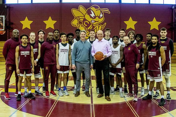 George Lengvari visits the basketball team at the Loyola gym.