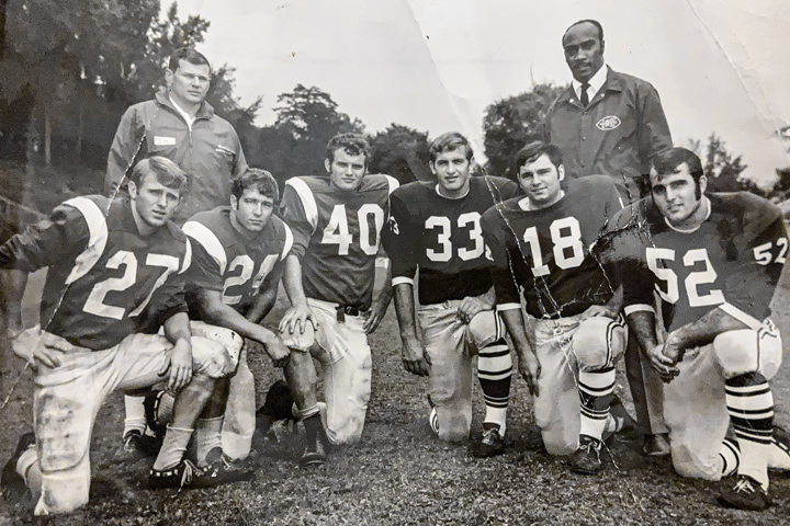 George Dixon and his Loyola players pose with crosstown rivals.
