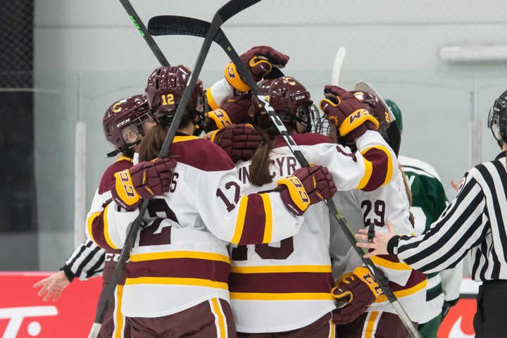 Concordia Stingers women's hockey players celebrate