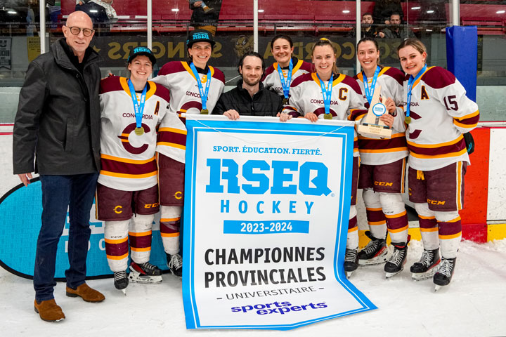 Concordia President and Vice-Chancellor, Graham Carr, with members of the Concordia women's hockey team