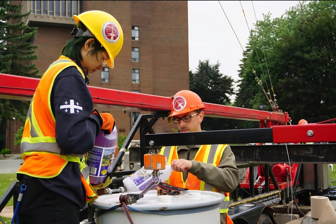 Gianni Gallaccio preps for a cryo flow test of the rocket by filling a barrel with methanol and water.