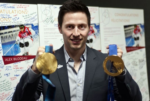 Alexandre Bilodeau shows off his two Olympic gold medals