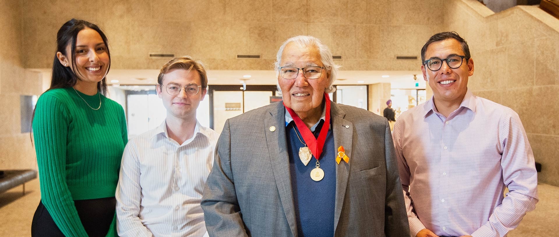 Murray Sinclair with three Concordia students