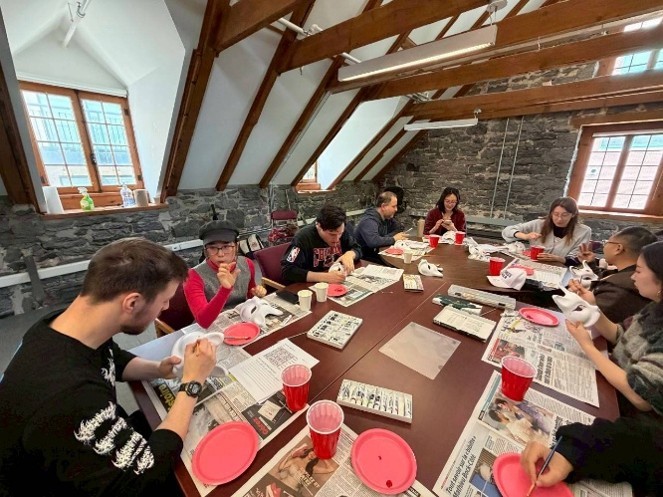 Photo of participants painting masks