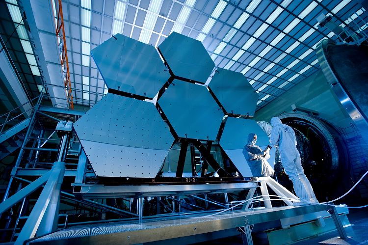 Surface engineers dressed in white one-piece suits