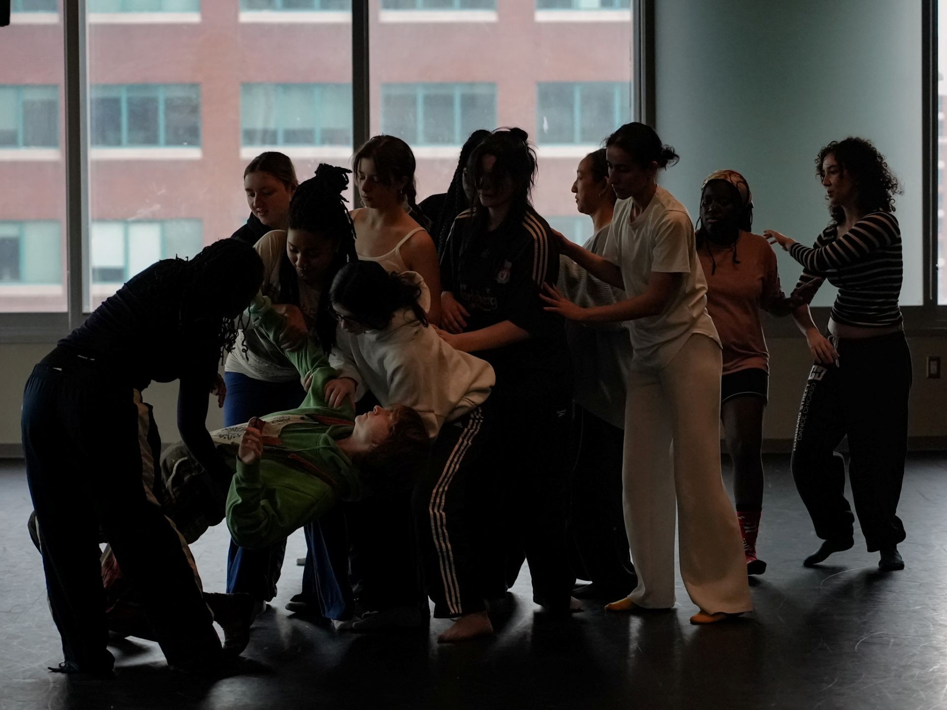 Students clustered together, dancing