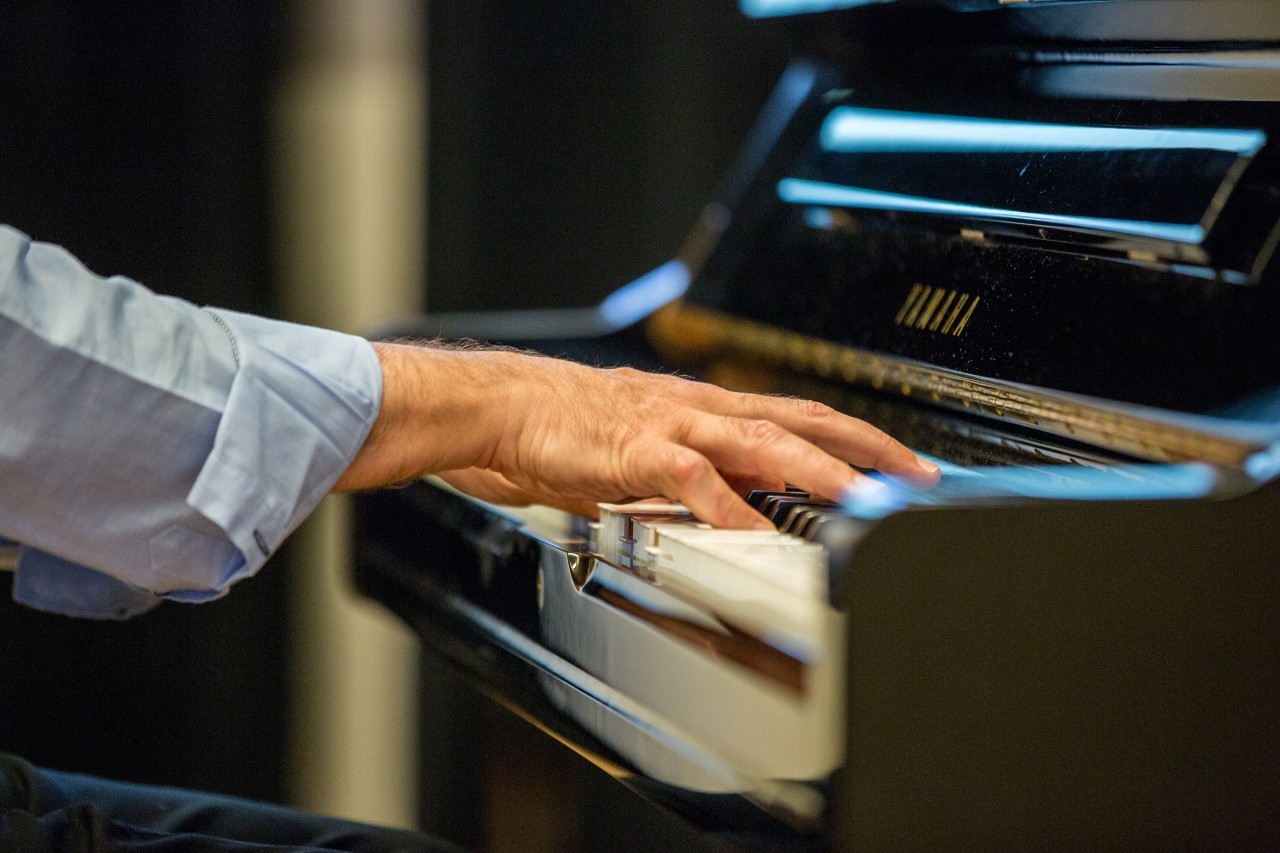 Hands of a pianist on the piano