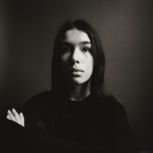 A high-contrast black and white head-and-shoulders portrait of Salomé Villeneuve