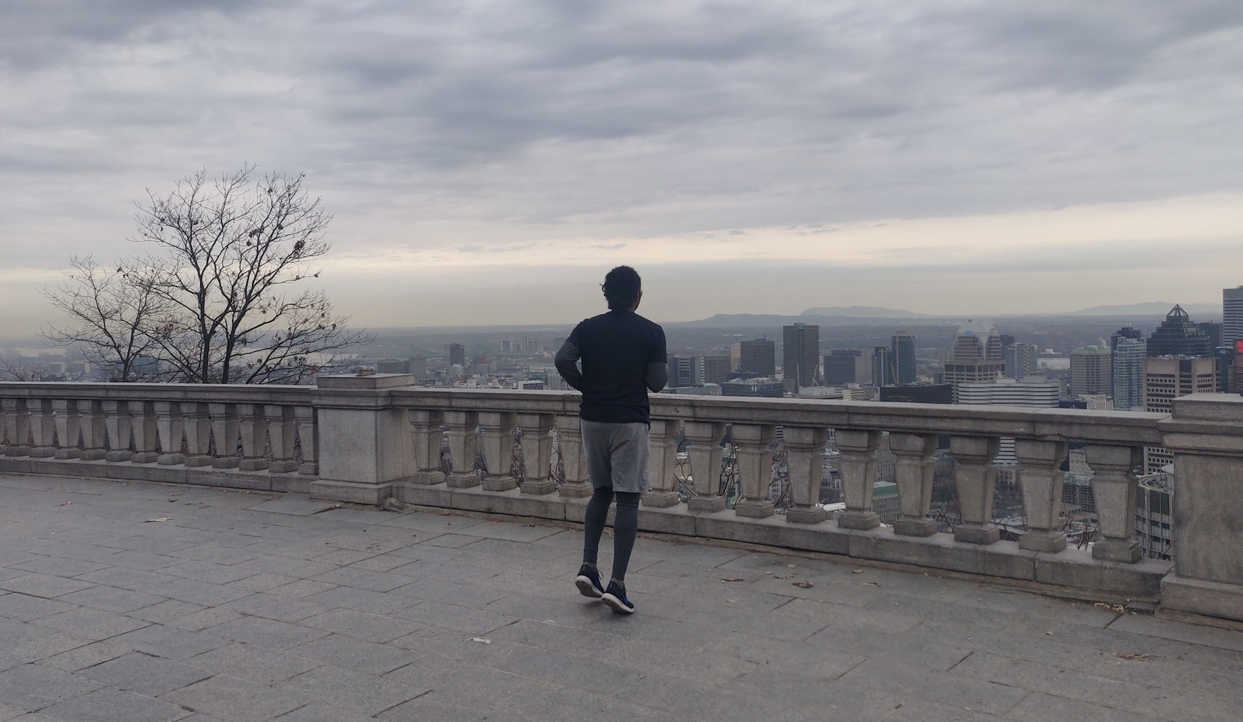 Runner standing at the top of Mount Royal