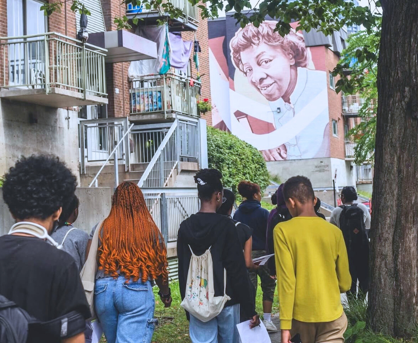 Youth from Harambec's Freedom School walking in Little Burgundy