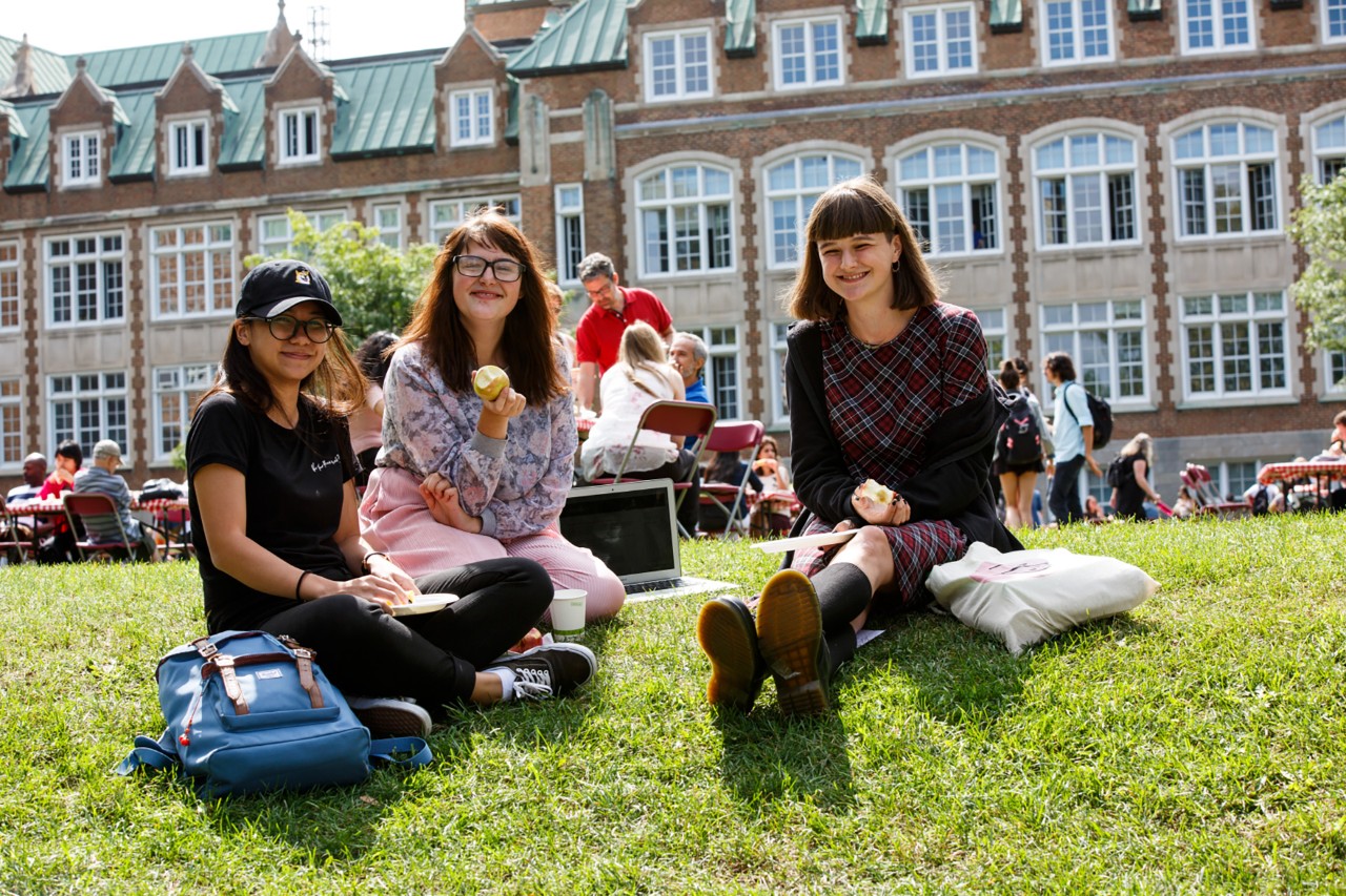 students sitting next to each other at Loyola campus 