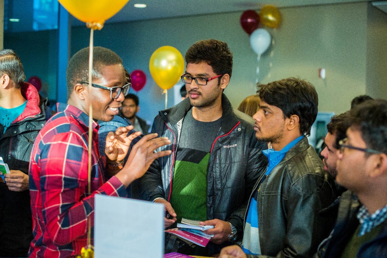 students sitting next to each other at Loyola campus 