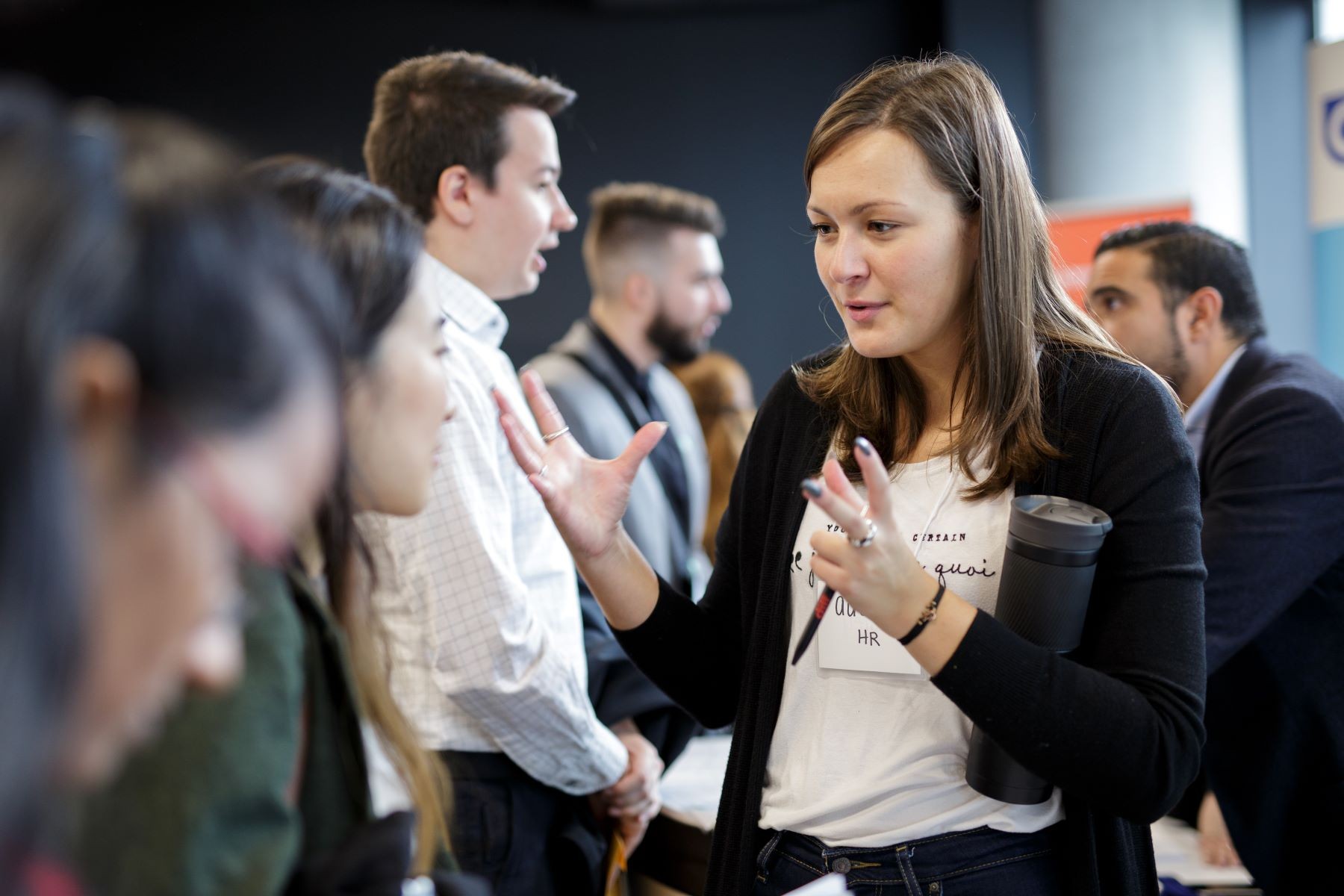 A group of young professionals takes notes