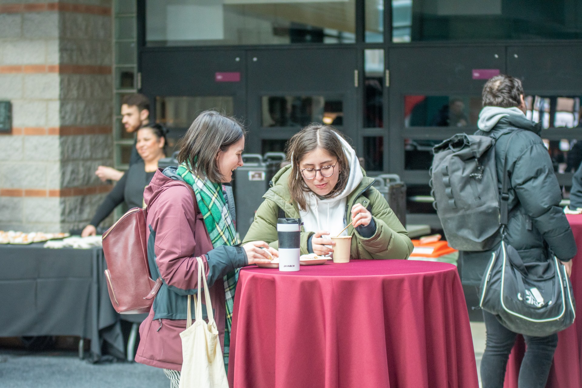 students sitting next to each other at Loyola campus 