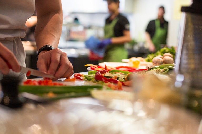 Someone cutting food