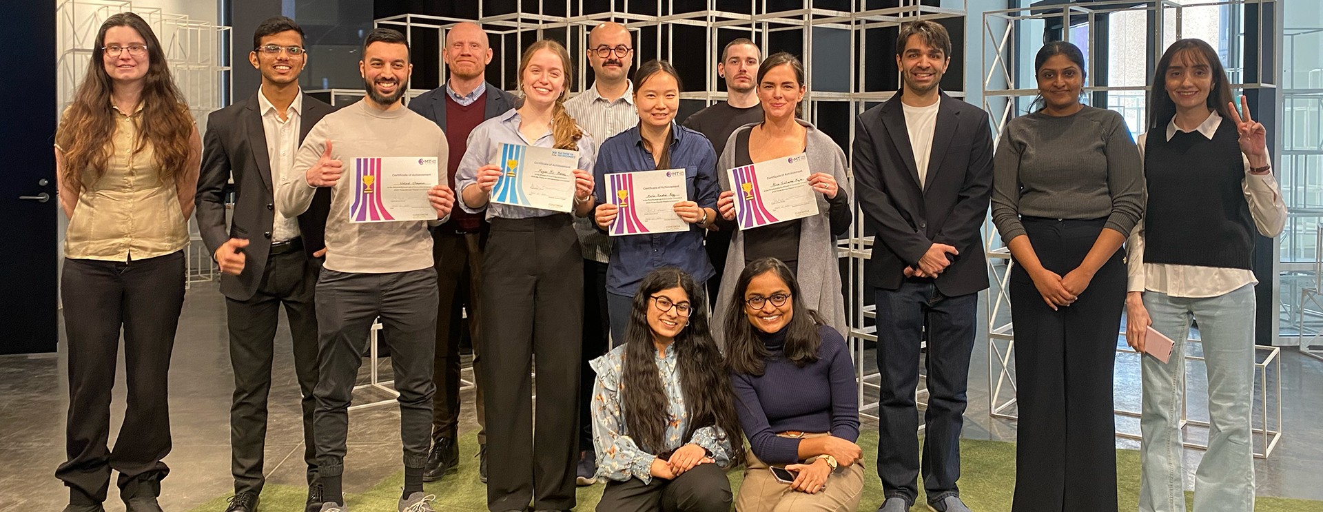 Winners and participants of Concordia 2025 3MT competition standing in a row and smiling at the camera