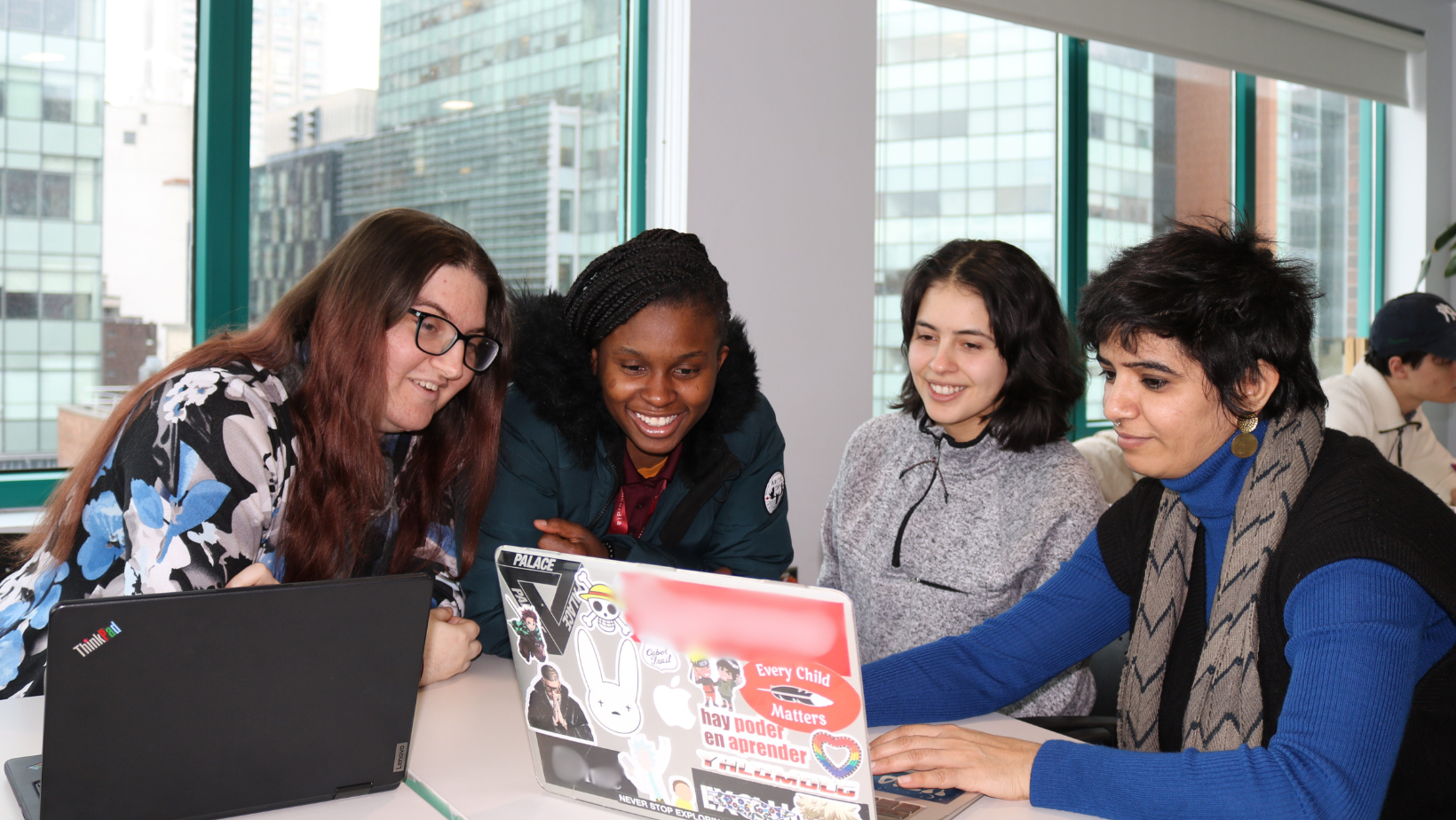 4 people working on a project together