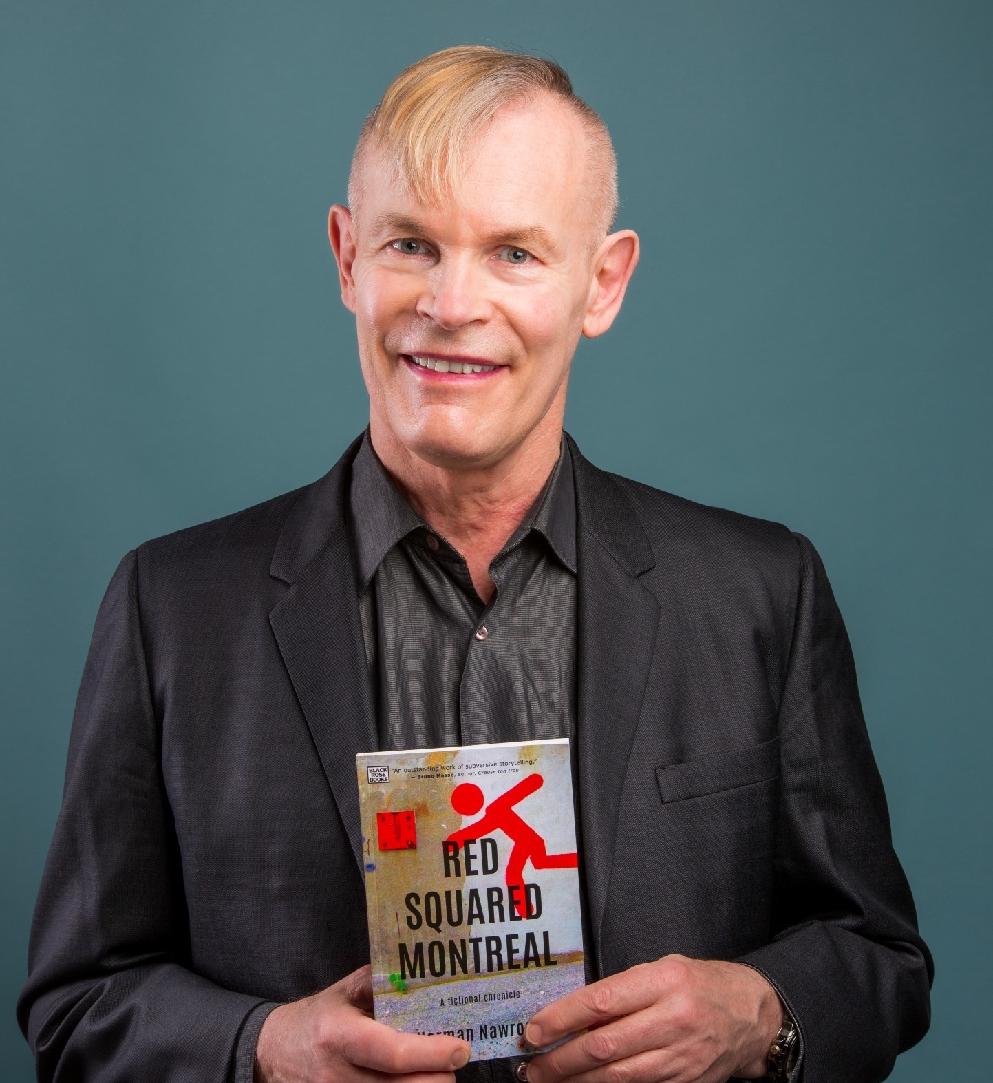 Nawrocki poses with a copy of his book, 'Red Squared Montreal: A Fictional Chronicle