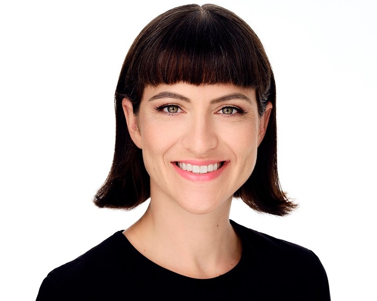 Mireille Paquet Mireille is shown from the shoulders up, wearing a black sweater. Her hair is dark brown and is styled in a short bob.