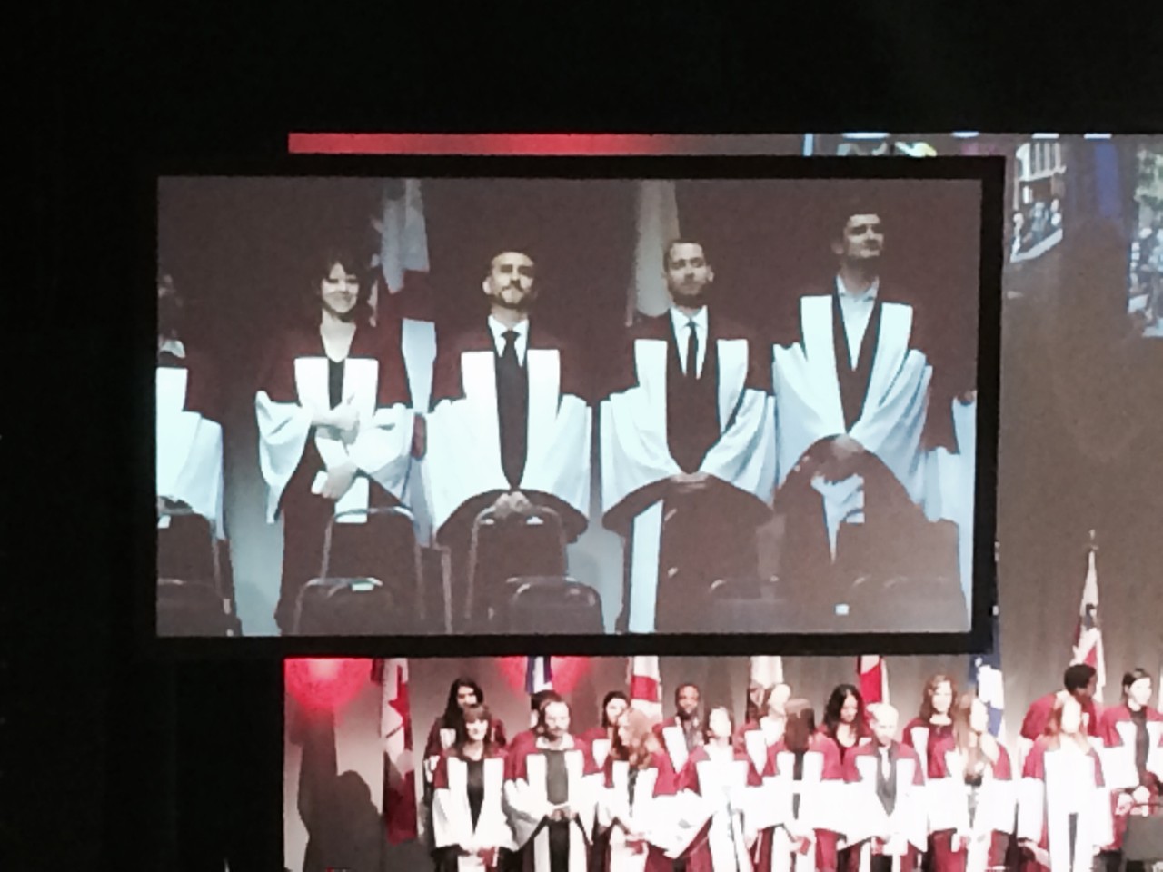 HUMA grads on stage