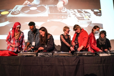 Students from the Institute perform on stage with artist Maria Chavez