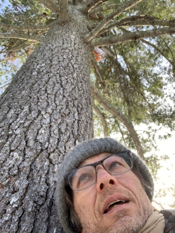 Photo of Owen Chapman next to tree