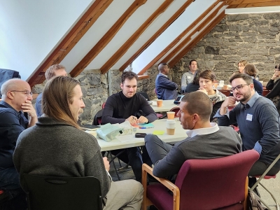 A group of researchers in discussion at the TransNex conference