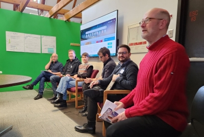 Photo of a panel presenting at TransNex