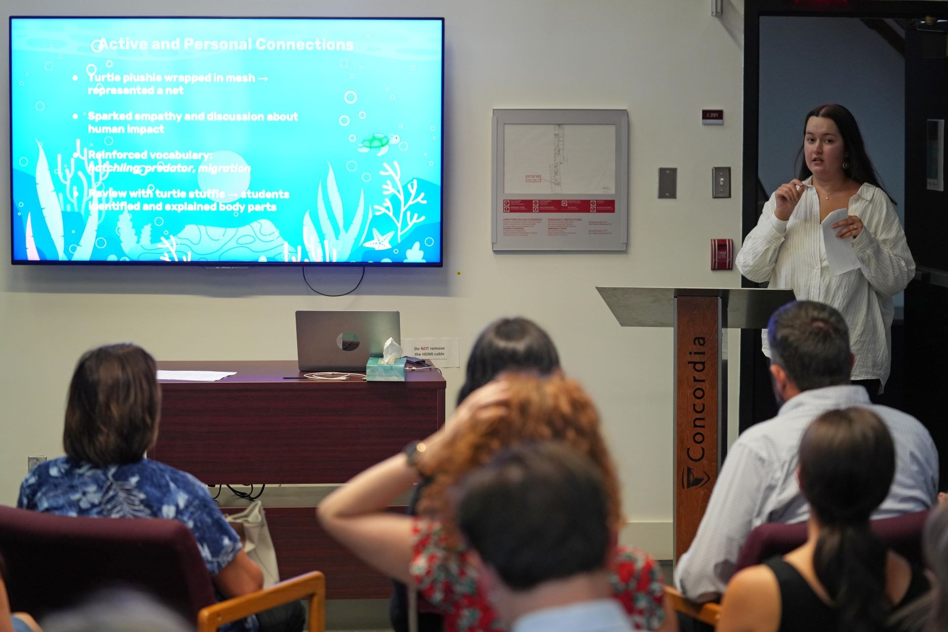 Photo of Jasmine Belanger presenting