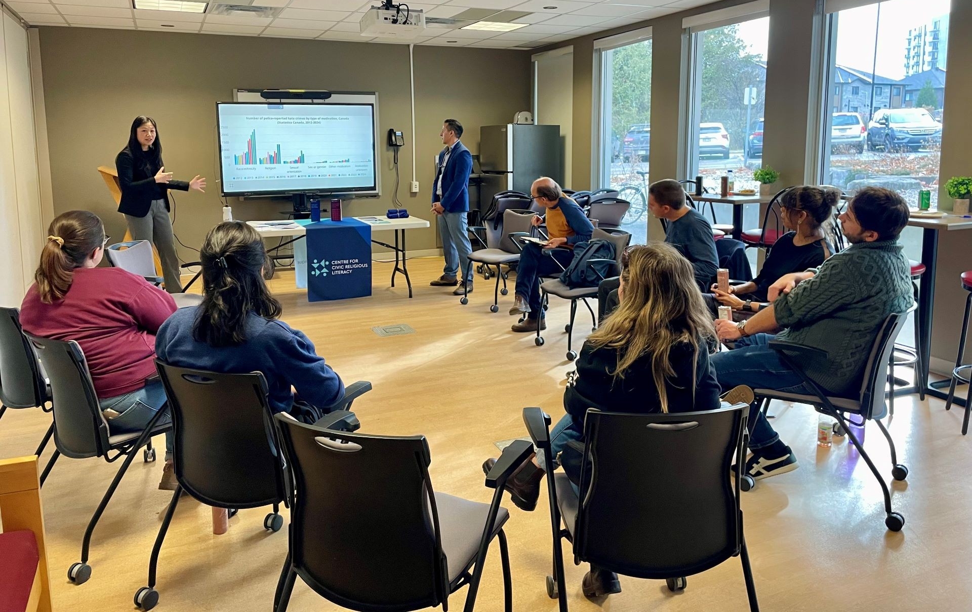 Photo of Alice Chan and Hicham Tiflati presenting to teachers