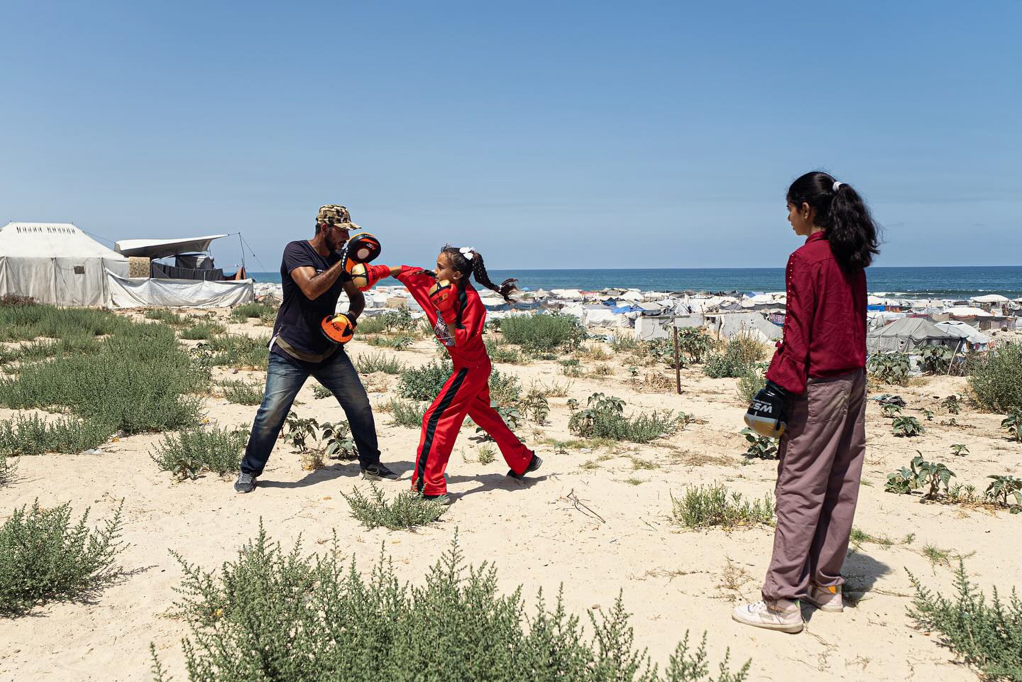 Photos of girls training with coach in the Gaza Women's Boxing Club