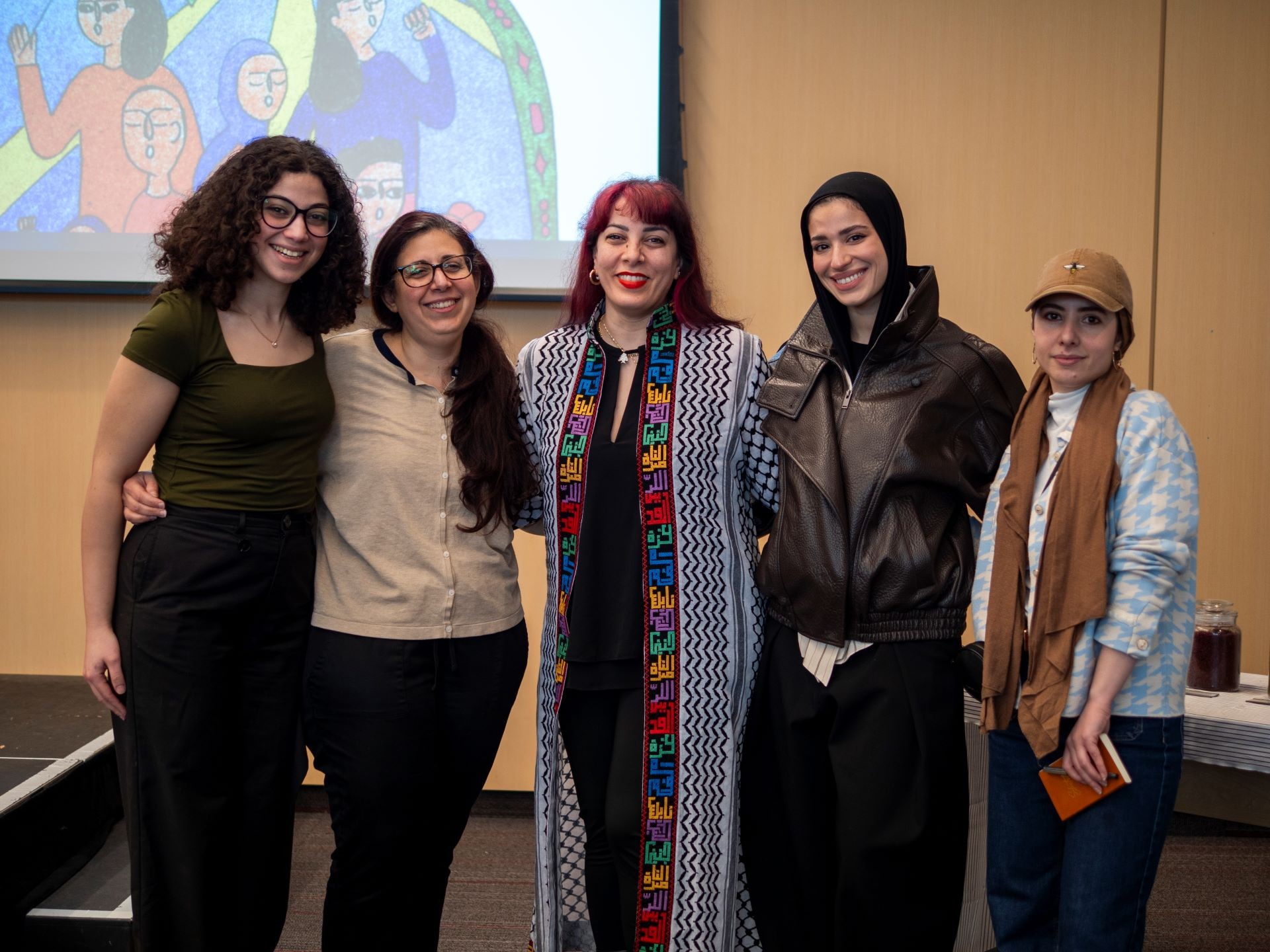 Conference organizers Rawda Harb & Taw’ama El-Kaddouri with friends