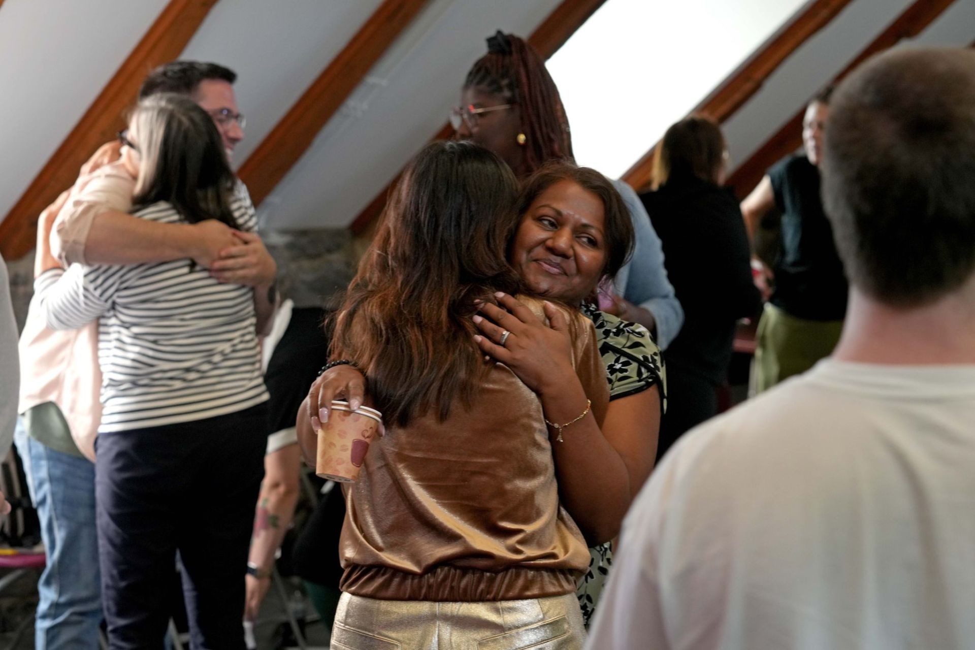 Participants hug at the end of the workshop